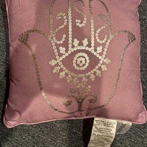 Decorative Pink Pillow with Silver Hamsa Design